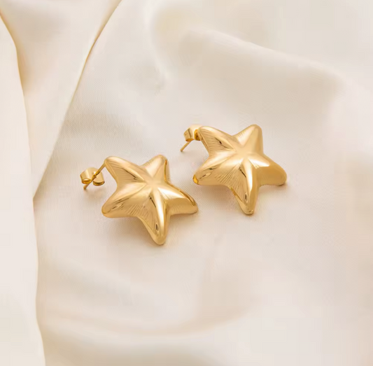 Aretes de estrella color oro
